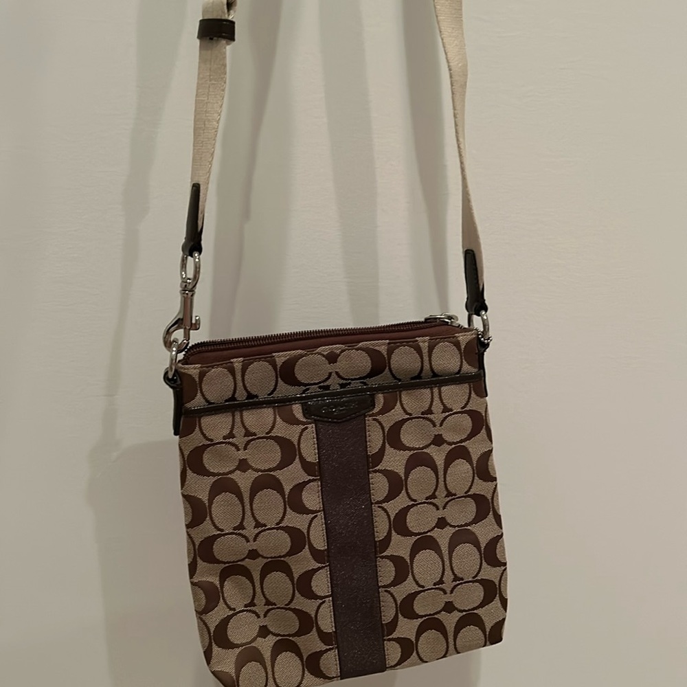 Coach crossbody.  Tan and brown with cream-colored adjustable strap